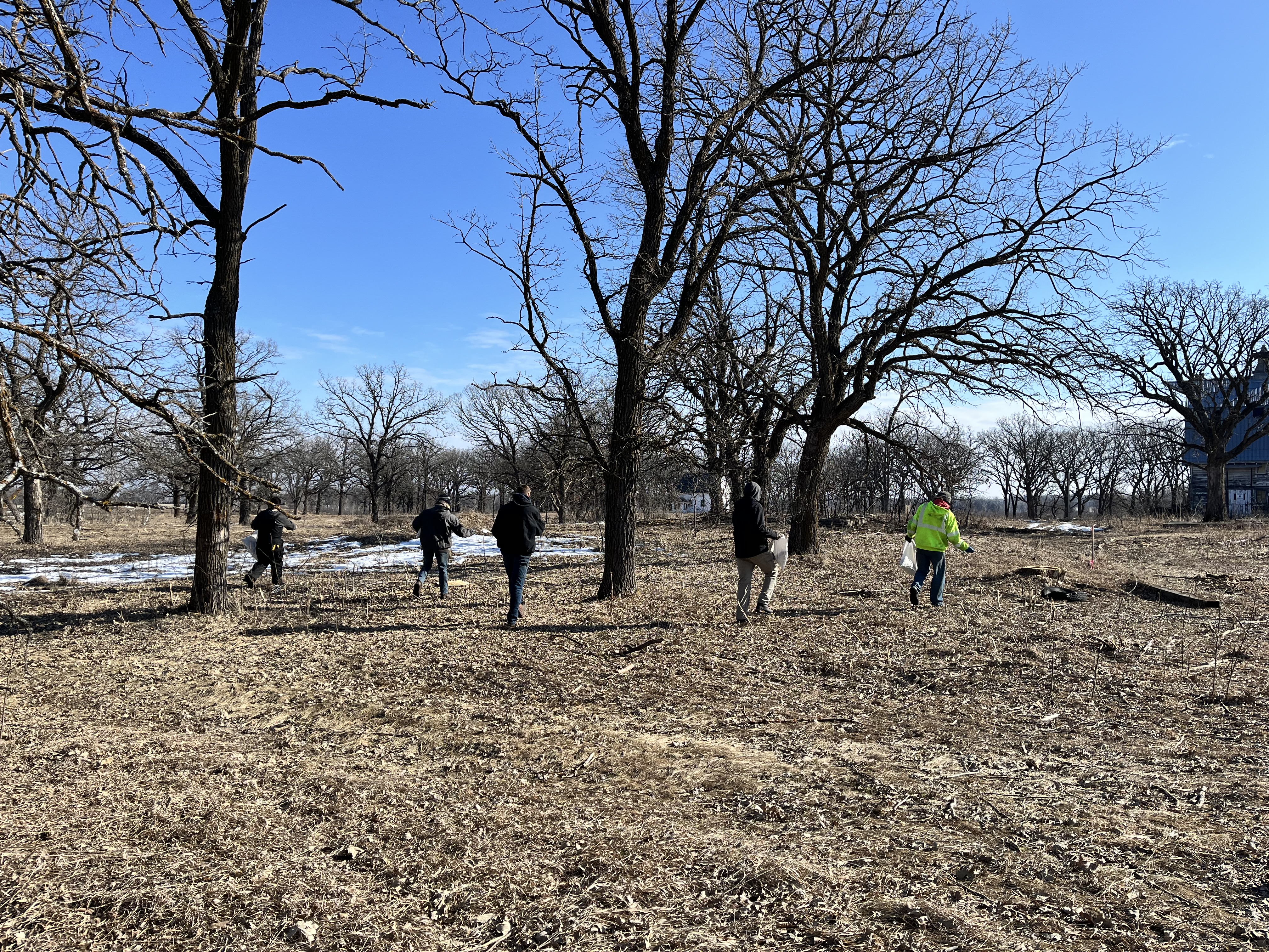Restoration workers are hand seeding native plants at Two Inlets.